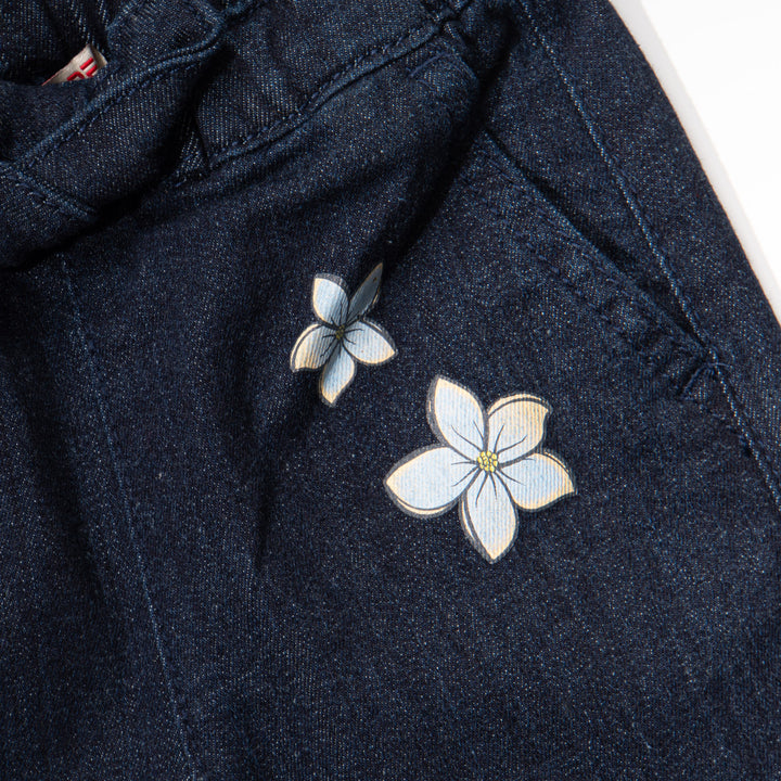 Indigo black jeans for girls, floral embossed prints above the hem and below the waist. A denim ribbon tie on waistband. Two front pockets included.Elasticated.  