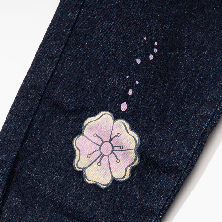 Indigo black jeans for girls, floral embossed prints above the hem and below the waist. A denim ribbon tie on waistband. Two front pockets included.Elasticated.  