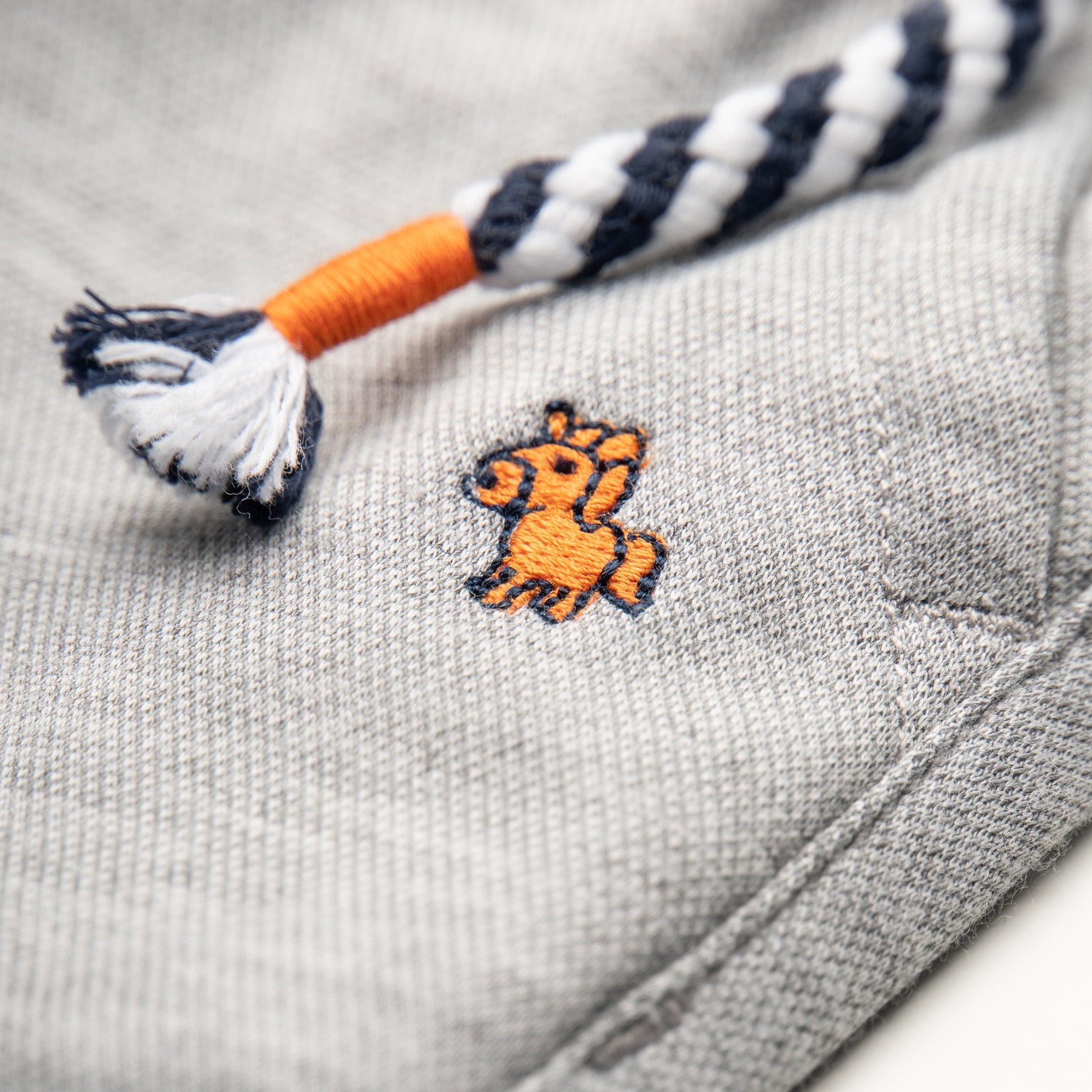 Melange Joggers, pockets included and embroidered logo Elasticated navy waistband, matching cords included.