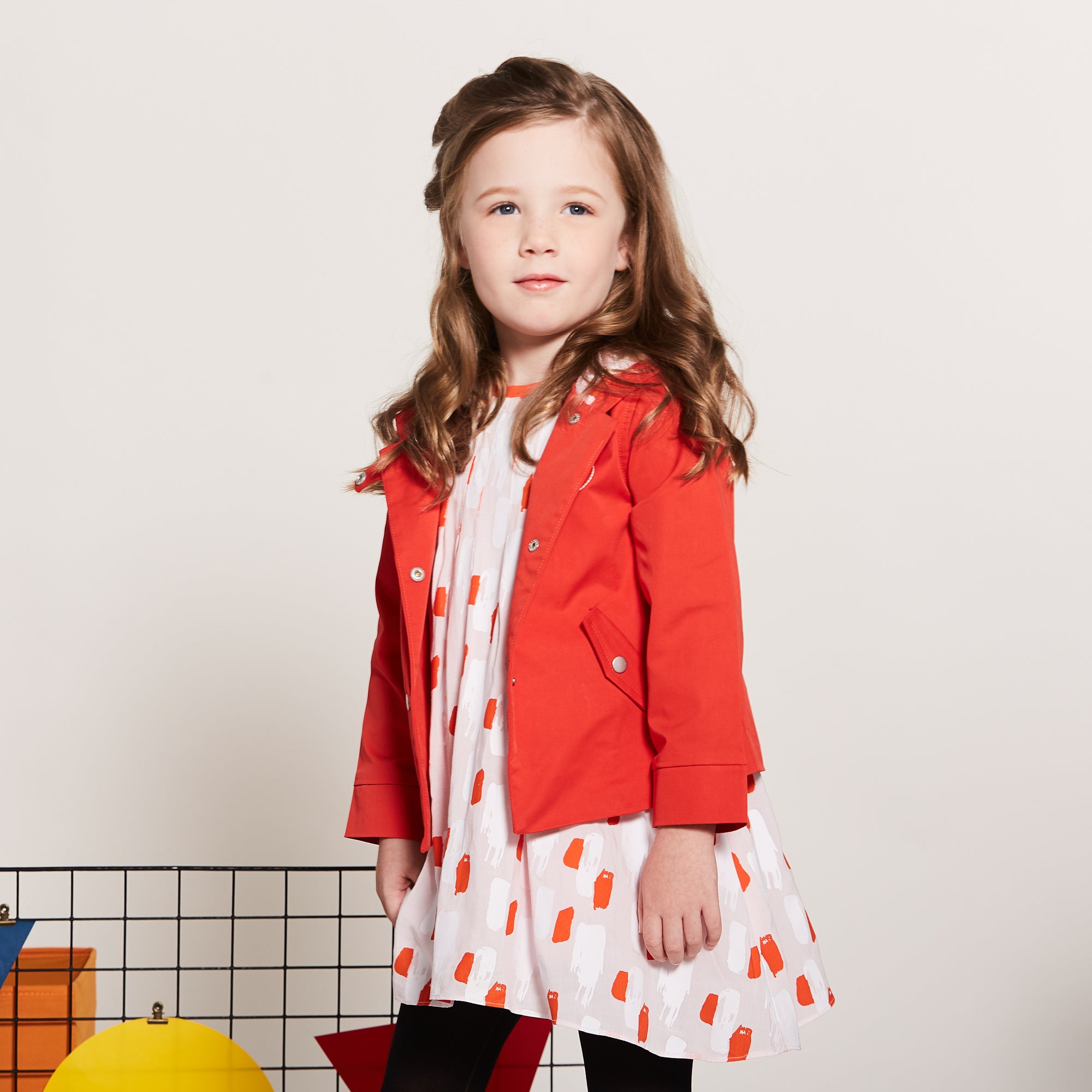 Orange Cotton Jacket, Lined by next-to-skin fabric , two Front pockets, front lining fastened by snap buttons, heart shaped logo embroidered at the front.