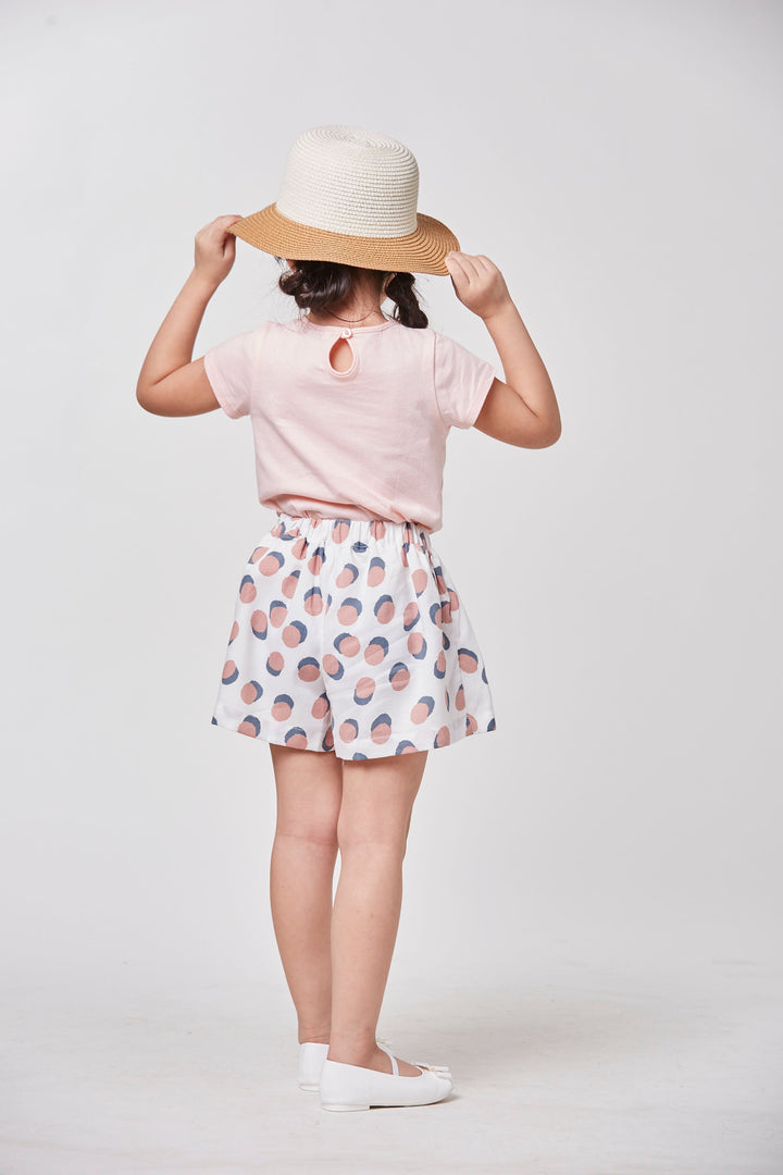 Light pink 'poney' heart t-shirt, short sleeve, a buttoned nape. 