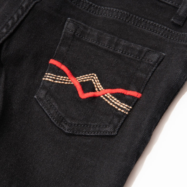 Elasticated Black Jeans, front zipper and button fastening. Embroidered back pockets, adjustable button included in the waist band.  