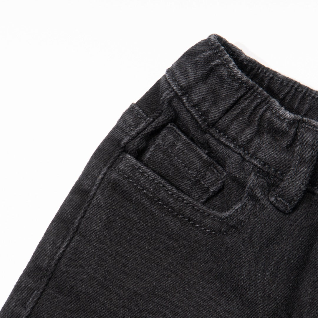 Elasticated Black Jeans, front zipper and button fastening. Embroidered back pockets, adjustable button included in the waist band.  