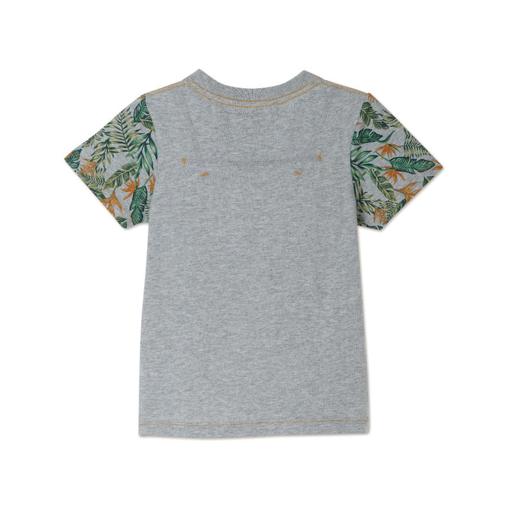 Melange top, short sleeve, beautiful tropical leaves design on sleeves and pocket. Buttoned shoulder strap, a logo strap on the bottom. 