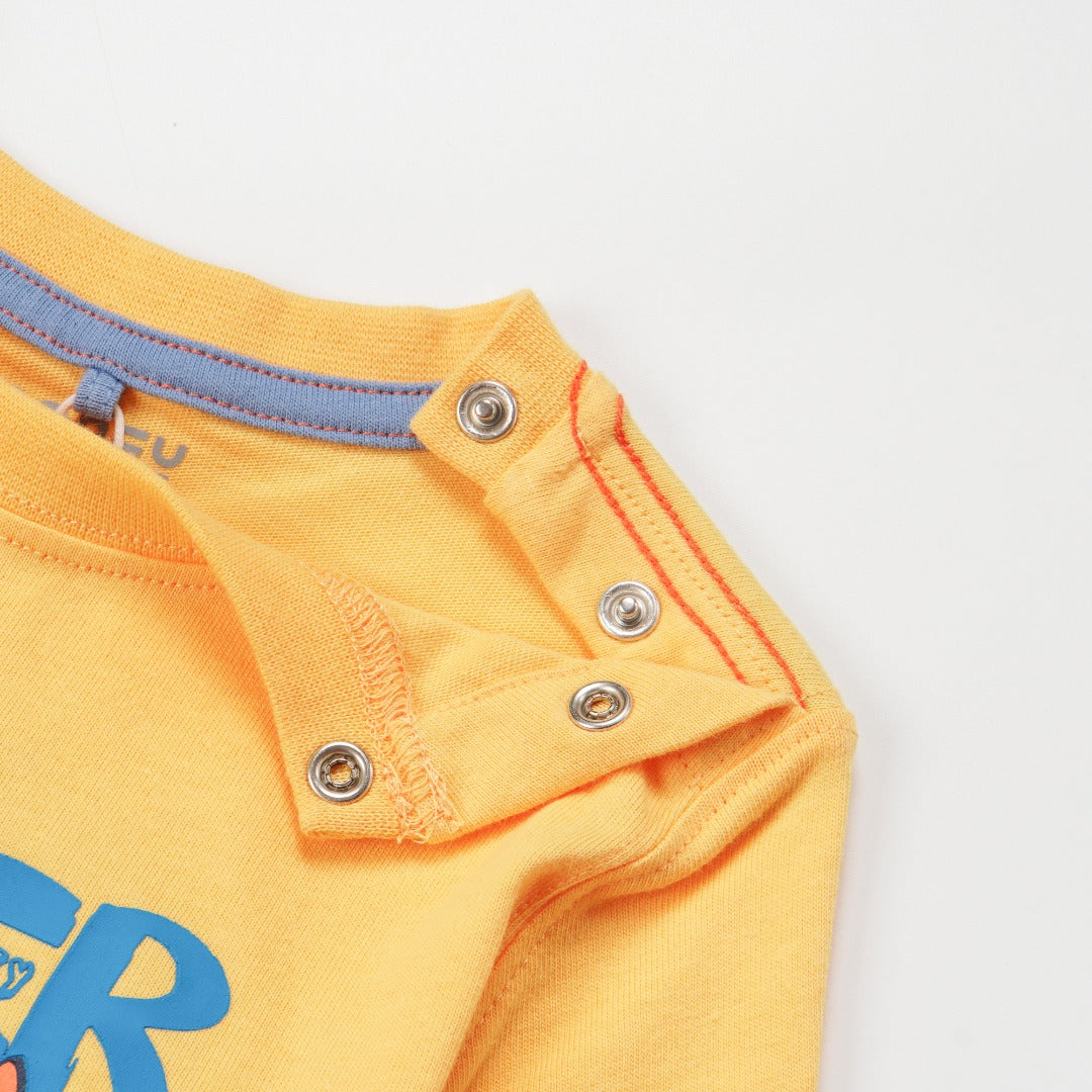 'Super Cool Monster' printed, yellow top, long sleeves, shoulder buttons. 