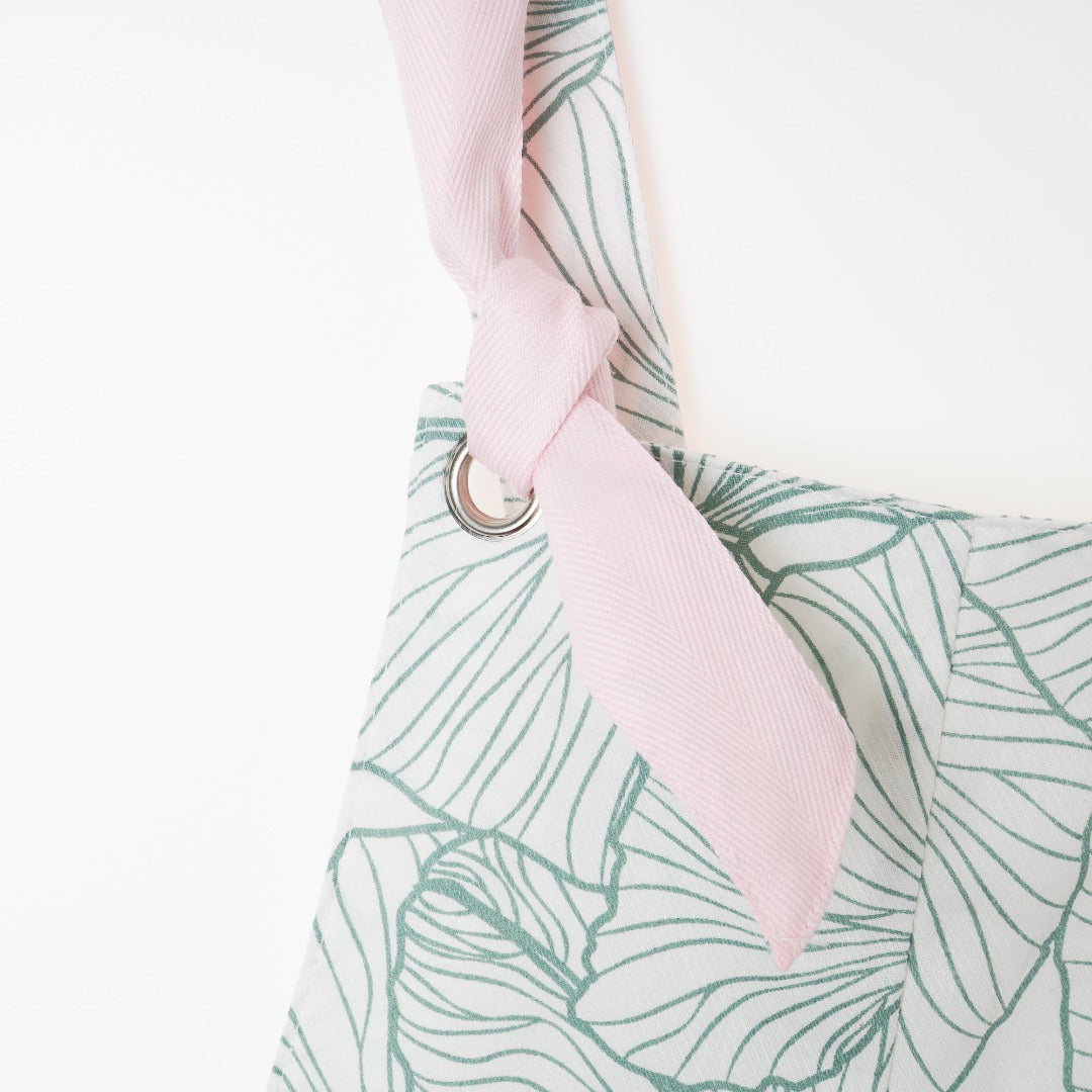 Lotus leaf themed dungaree, pink straps. Side zipper fastening included. 