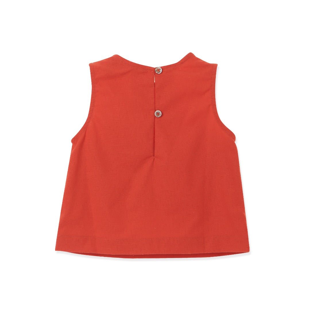 Red sleeveless blouse, fancy large bow. Back fastened by two buttons. 