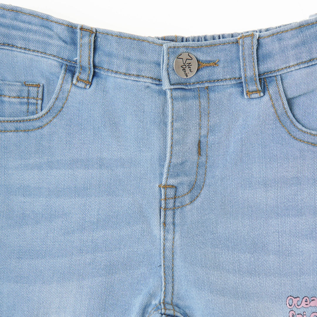 Slightly distressed, faded, embroidered, embossed, denim for girls with an ocean theme. Waistband Adjustments, front button/zipper fastening included. 