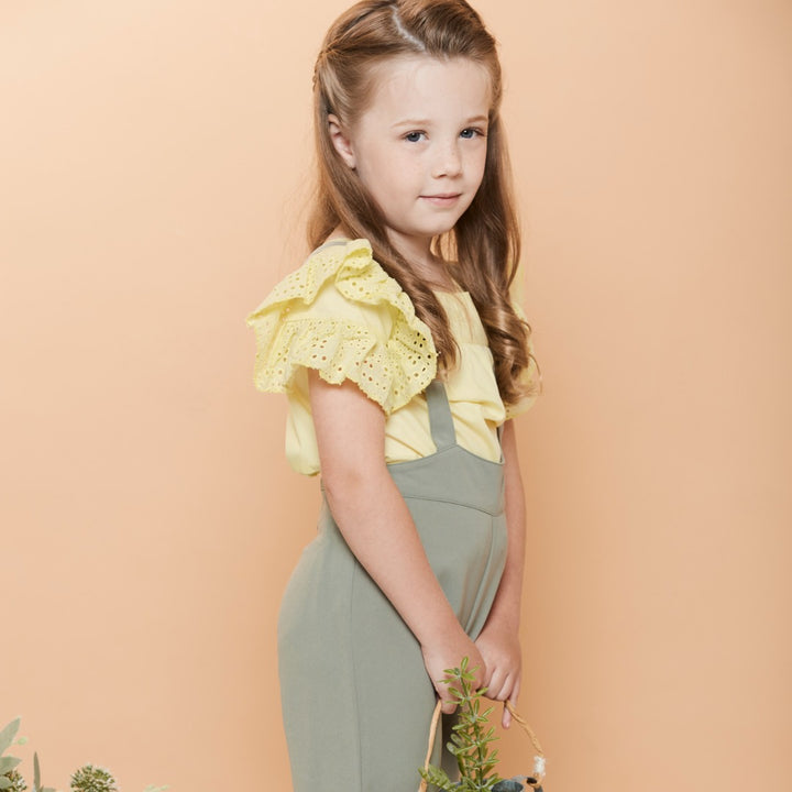 Double frilled sleeves and hem blouse, buttons at the front. Embroidered poney logo below the neck. 