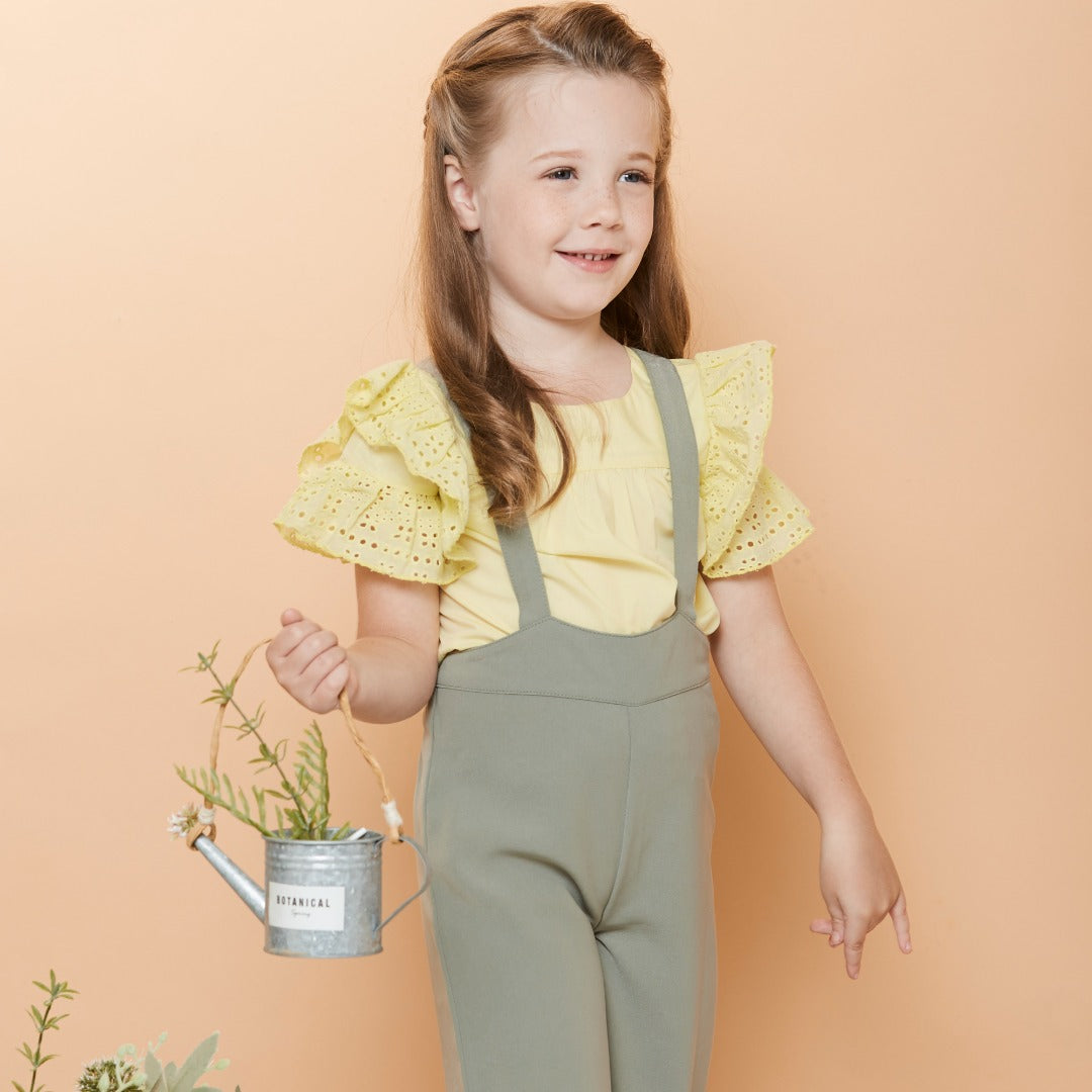 Double frilled sleeves and hem blouse, buttons at the front. Embroidered poney logo below the neck. 