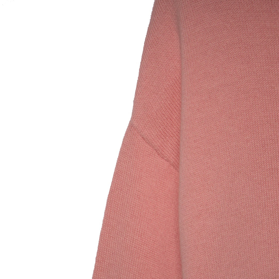 Comfortable tea pink, long sleeve cardigan, fastened from the front with pearl white buttons.