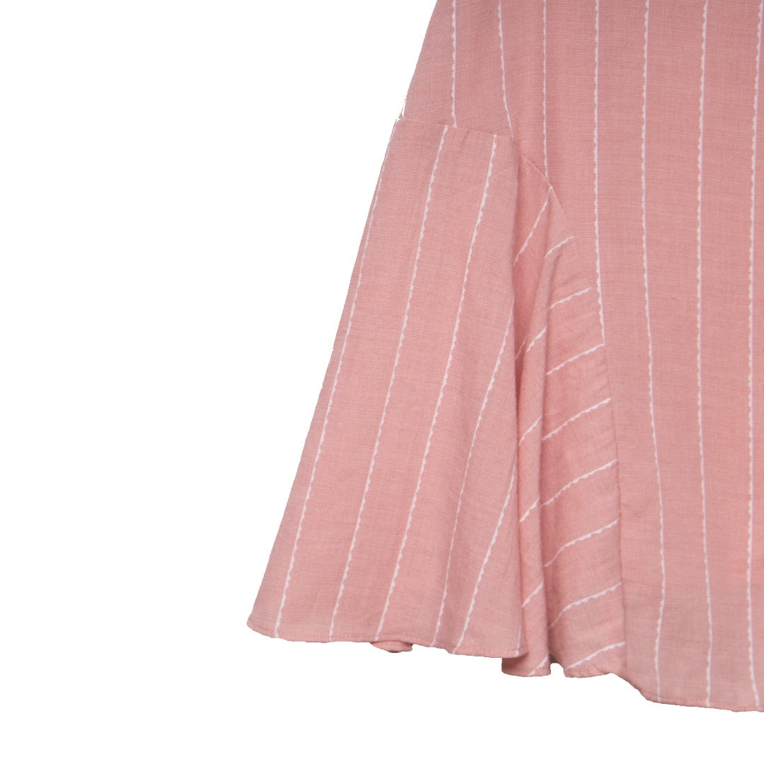 Short-sleeved, white striped, loose fitted, light pink dress with side panels. A zipper attached at the back.