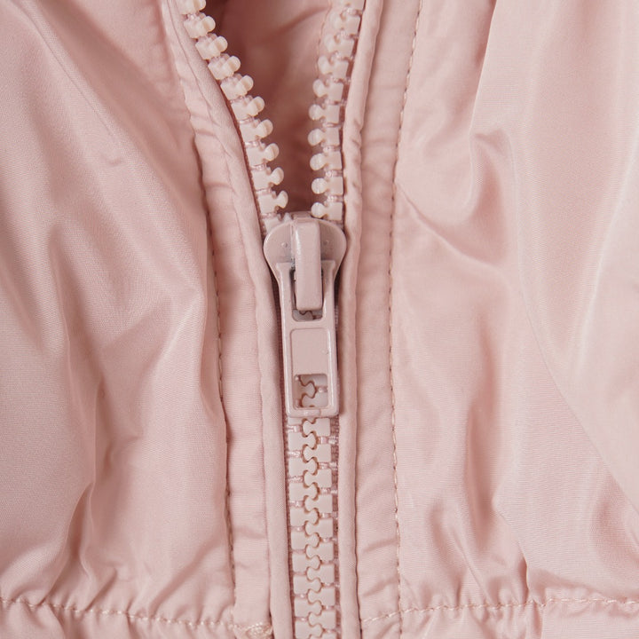 Pale-Rose Light-padded jacket with high collar and long sleeves. Zip-up front, matching side pockets and elasticated cuffs. Slightly longer back-hem.