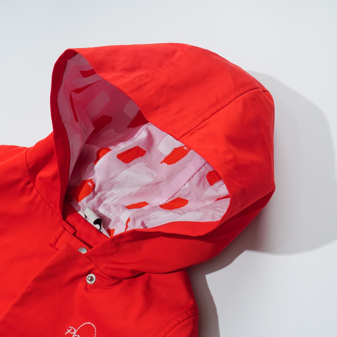 Orange Cotton Jacket, Lined by next-to-skin fabric , two Front pockets, front lining fastened by snap buttons, heart shaped logo embroidered at the front.