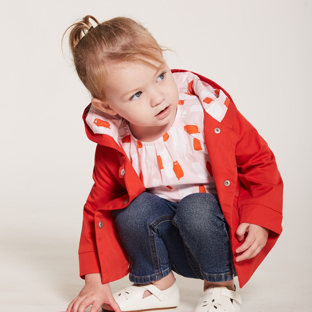 Orange Cotton Jacket, Lined by next-to-skin fabric , two Front pockets, front lining fastened by snap buttons, heart shaped logo embroidered at the front.