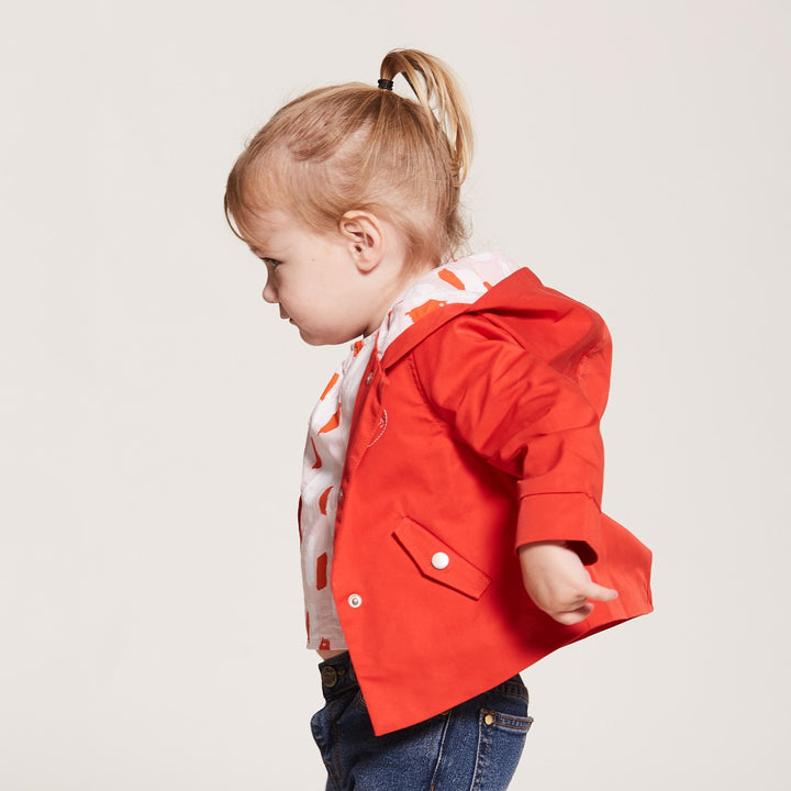 Orange Cotton Jacket, Lined by next-to-skin fabric , two Front pockets, front lining fastened by snap buttons, heart shaped logo embroidered at the front.